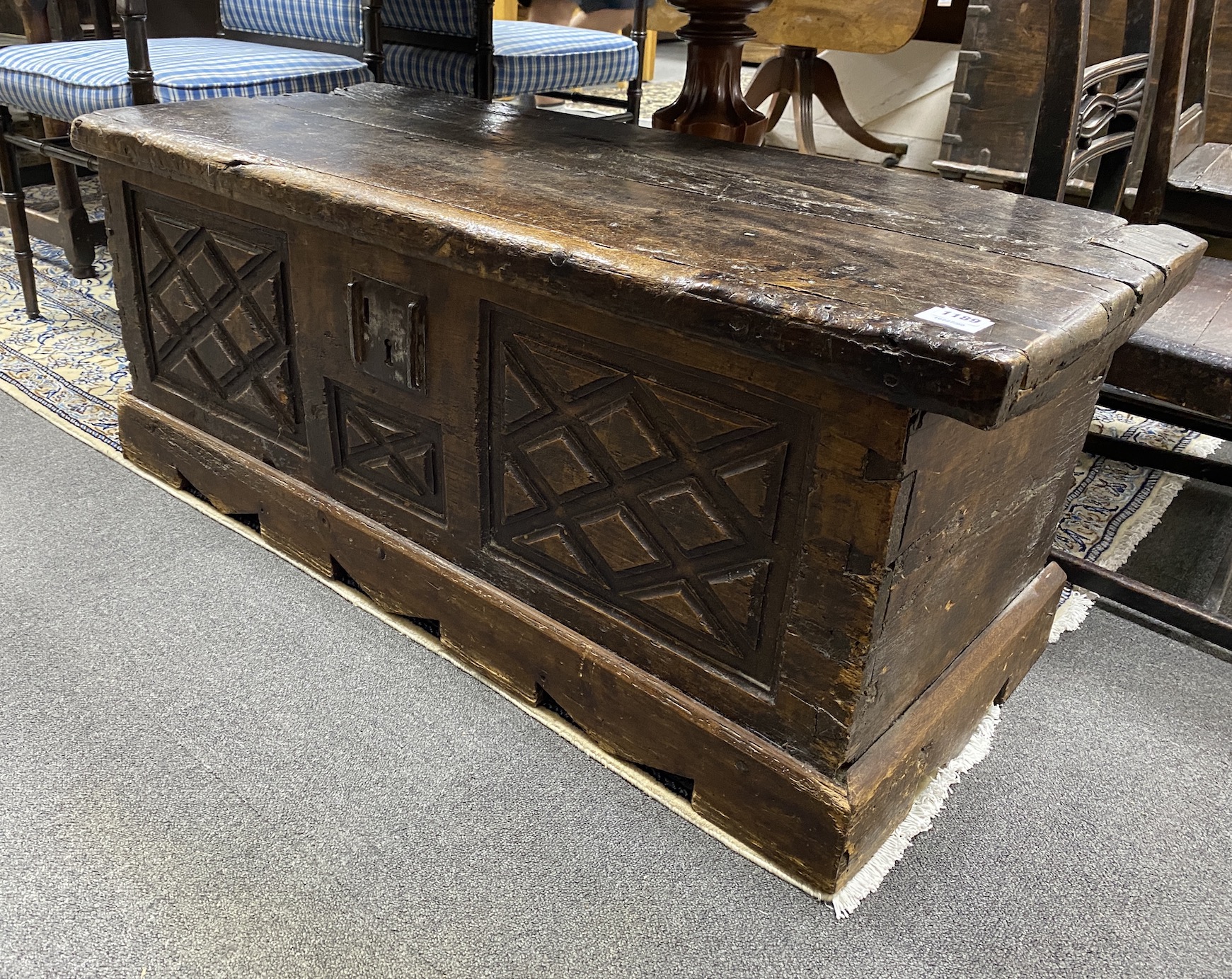 An 18th century Spanish carved walnut coffer, length 114cm, depth 49cm, height 47cm
